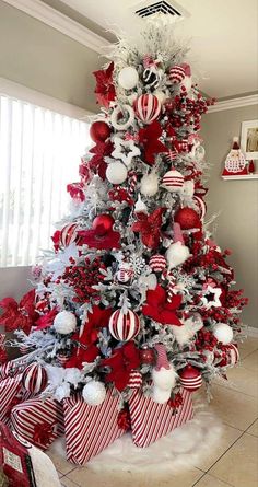 a christmas tree decorated with red and white ornaments