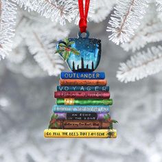 a stack of books hanging from a christmas tree