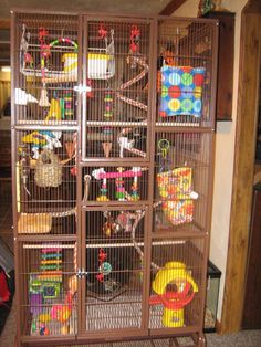 a large bird cage filled with lots of toys