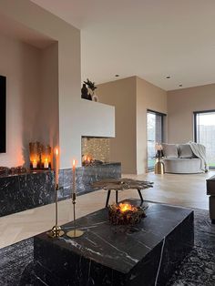 a living room filled with furniture and a fire place