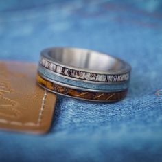 a close up of a ring on top of a wallet