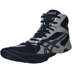 a pair of black and white shoes with the word asics written on the side