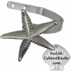 a starfish is attached to a metal hook with the words sealife cabinet knobs com