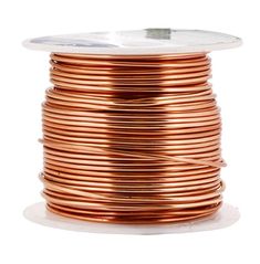 a spool of copper wire on a white background