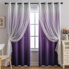 purple and white curtains hanging in front of a window