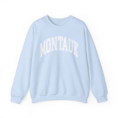 This COZY & COMFY sweatshirt is perfect for your summer getaway or a cozy favorite year round! It is an adult unisex crewneck made from a cotton/poly blend with distressed lettering for a true beachy vintage look. There are no itchy side seams, it is super soft and one you will reach for again and again!  ♥ SIZE AND FIT - Please refer to the size chart in the photos for exact dimensions. A pro tip for a good fit is to lay your favorite fitting sweatshirt flat then measure across the fullest part of the chest for the width and from the highest point of the shoulder down to the bottom hem for length. This sweatshirt runs true to size and slightly relaxed so it is recommended that you size down for a fitted look and size up 1-2 sizes for a trendy oversized fit! ♥ FABRIC CARE - Machine wash co Montauk Sweatshirt, Madhappy Sweatshirt, Montauk Long Island, Distressed Lettering, Aesthetic Sweatshirt, Long Island New York, Varsity Style, Blue Crewneck, Summer Getaway