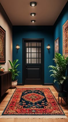 a hallway with blue walls and rugs, potted plants and pictures on the wall