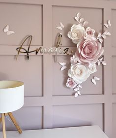 there is a wall decoration with flowers on it