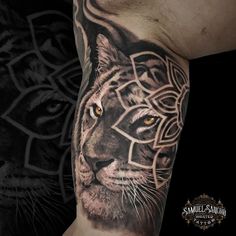 a man with a tiger tattoo on his arm