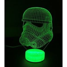 a 3d image of a helmet on top of a green light with a black background