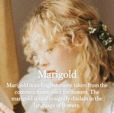 a woman with long blonde hair wearing a flower in her hair and text that reads, margold