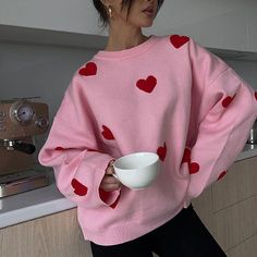 This sweater comes in a knit construction, with a crew neck, ribbed trim, and a heart print all over Size:• S: Bust: 104cm/ 40.9 in, Length: 60cm/ 23.6 in, Sleeves: 52cm/ 20.5 in• M: Bust: 108cm/ 42.5 in, Length: 61cm/ 24.0 in, Sleeves: 53cm/ 20.9 in• L: Bust: 112cm/ 44.1 in, Length: 62cm/ 24.4 in, Sleeves: 54cm/ 21.3 in Material: Polyester Pink Heart Print Sweater For Valentine's Day, Knit Crew Neck Sweater With Heart Print, Cute Heart Print Winter Sweater, Winter Heart Print Sweater, Cute Winter Sweater With Heart Print, Winter Heart-shaped Sweater With Heart Print, Cozy Heart Print Winter Sweater, Spring Sweater With Heart Print, Cute Crew Neck Knit Sweater