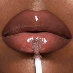 My high-shine, sheer lip gloss in my ICONIC nude-pink shade for fuller-looking lips! Lip Gloss Colors Shades, Lip Gloss Photoshoot, Lip Gloss Business Photoshoot Ideas, Lip Gloss Photoshoot Ideas, Brown Glossy Lips, Charlotte Tilbury Pillow Talk Lipgloss, Aesthetic Skincare Products, Charlotte Tilbury Collagen Lip Bath, Charlotte Tilbury Lip Set