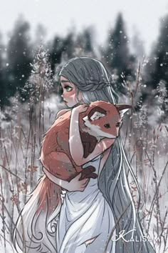 a woman with long hair holding a fox in her arms while standing in the snow