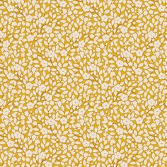 a yellow and white floral pattern on fabric