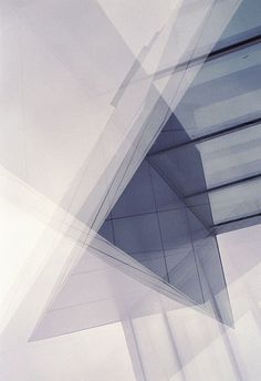 an abstract photograph of some kind of structure with lines and shapes in the background,