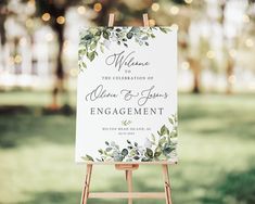 an easel with a sign on it that says welcome to the celebration of john and jenny's engagement