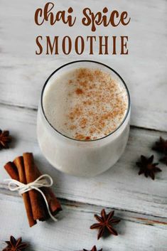 cinnamon spice smoothie in a glass with cinnamon sticks and star anise on the side