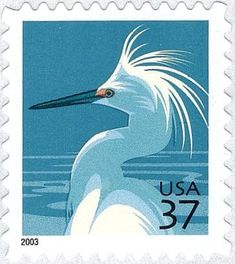 a postage stamp with an image of a white bird on the front and blue background