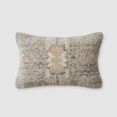 a pillow with an old, faded design on the front and back of it's cover