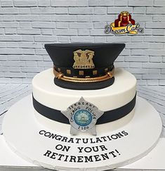 there is a cake that says congratulations on your retirement with a police officer's hat