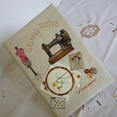 an embroidered book with sewing notes on it