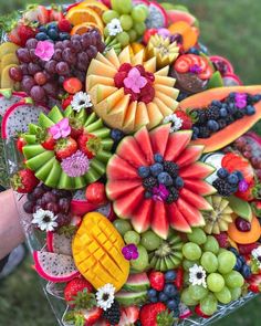 a bunch of fruit is arranged in the shape of a bouquet on instagrams