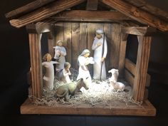 a nativity scene with figurines in a stable