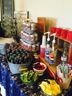 a table topped with lots of different types of food and drinks on top of it