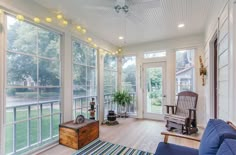 the sun room is clean and ready to be used for relaxing time on the porch