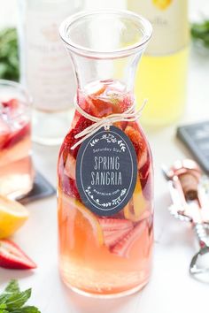 a pitcher filled with liquid sitting on top of a table