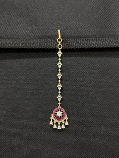 One gram gold polished CZ stone Maang Tikka. Chandbali Round design Traditional Tikka. Please allow some variation in color. Length from hook: 4.5 inches. Width: 0.75 inches. Base material is made of copper alloy. Maang Tikka Bridal, Bridal Tikka, Nethi Chutti, Indian Jewelry Traditional, Tikka Indian Jewelry, Tikka Jewelry, Chain Headpiece, Jewelry Traditional, Traditional Indian Jewellery