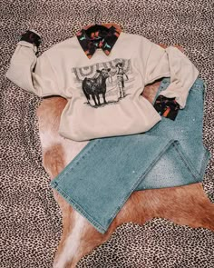 Where are my stockshow momma's at?! This unisex sweatshirt is just for you and warm too! Paired with our Rodeo Timin' Button Down underneath! Wrangler Cow Print Sweatshirt, Western Winter Shirt, Wrangler Sweatshirt Bleached, Cute Wrangler Sweatshirts, Sweatshirt Western Outfit, Punchy Sweater, Punchy Outfits Winter, Stock Show Outfits, Button Up Under Sweater