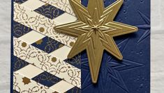 a blue and white card with a gold star on it