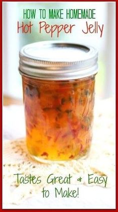 a jar filled with hot pepper jelly sitting on top of a white table next to a red frame