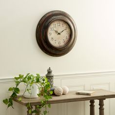 Our clock decor is ideal for retro, vintage, antique, and rustic-themed living spaces. Requires 1 AA battery. Battery not included. This item ships in 1 carton. This clock features Arabic numeral with minute marks. The clock mechanism runs silent. Keyhole hook at the top section allows for easy hanging; nails and screws are not included. Suitable for indoor use only. This is a single wall clock. Rustic style. Grayson Lane Metal with Fluted Frame Analog Round Wall Rustic in Brown | 34805 Vintage Fall Decor, Rustic Wall Clock, Unique Clocks, Vintage Wall Clock, Rustic Theme, Iron Metal, Clock Decor, Iron Material, Antique Inspiration