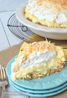 a close up of a piece of cake on a plate with another pie in the background