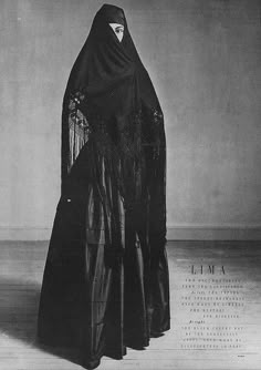 a black and white photo of a woman wearing a veil with the word i'm a written on it