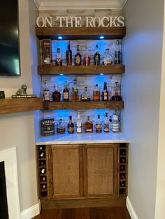 a room with shelves filled with bottles and liquor