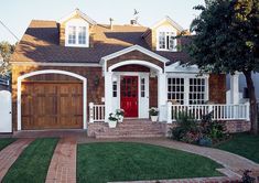 a house with white trim and red door