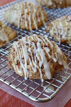 some cookies with icing sitting on a cooling rack