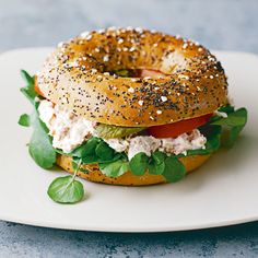 a bagel sandwich on a white plate