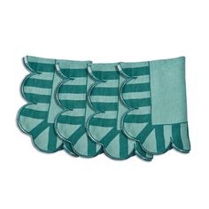 four teal blue and white striped scalloped placemats on a white background