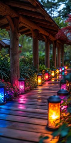 colorful lanterns lit up on a wooden walkway