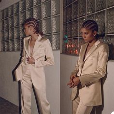 two women in white suits standing next to each other with their hands on their hips