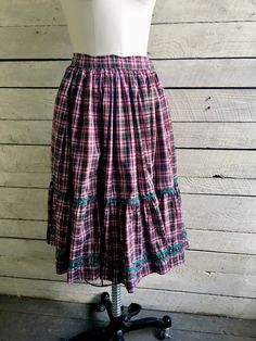 "50s red green plaid peasant skirt 2 tiers with green rick rack trim Full circle skirt Handmade Waist 26\" Length 25\" Width at hem 166\" (measured flat and doubled) Condition - very good vintage" Plaid Tiered Skirt With Ruffles, Plaid Tiered Ruffled Skirt, Vintage Green Tiered Skirt, Cotton Gingham Skirt With Ruffles, Vintage Plaid Cotton Skirt, Plaid Ruffled Cotton Skirt, Plaid Cotton Skirt With Ruffles, Retro Cotton Skirt With Ruffles, Hair Grower