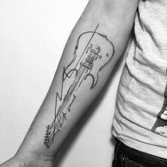 a person with a guitar tattoo on their arm