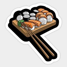 sushi with chopsticks on a wooden board