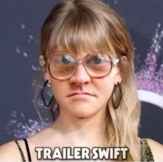 a woman wearing glasses with the caption trailer swiftt on it's face