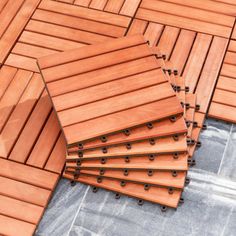 several pieces of wood laid out on top of each other with holes in the middle